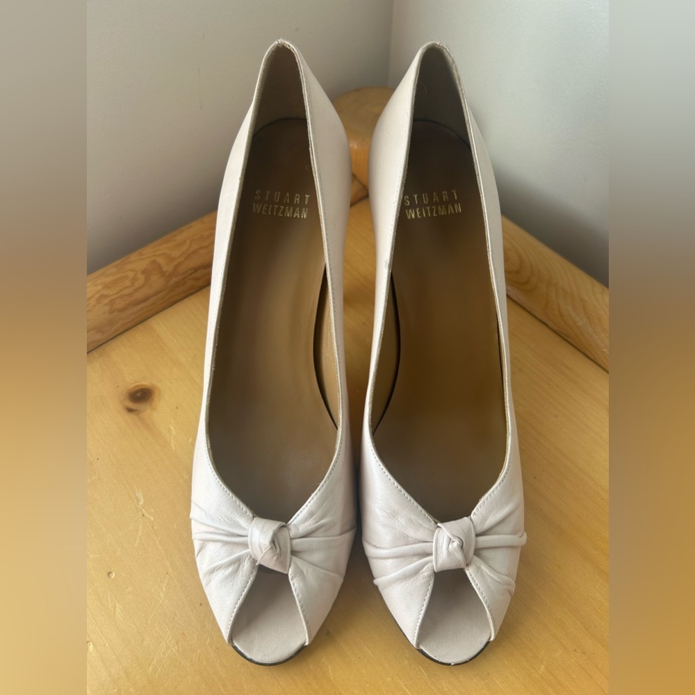Stewert Weitzman cream leather peep toe heel.